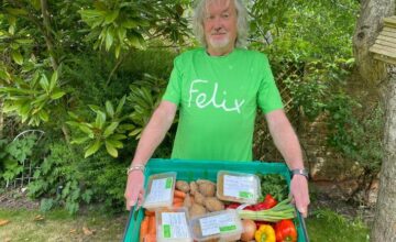 James May wearing a Felix t-shirt, holding crate of food