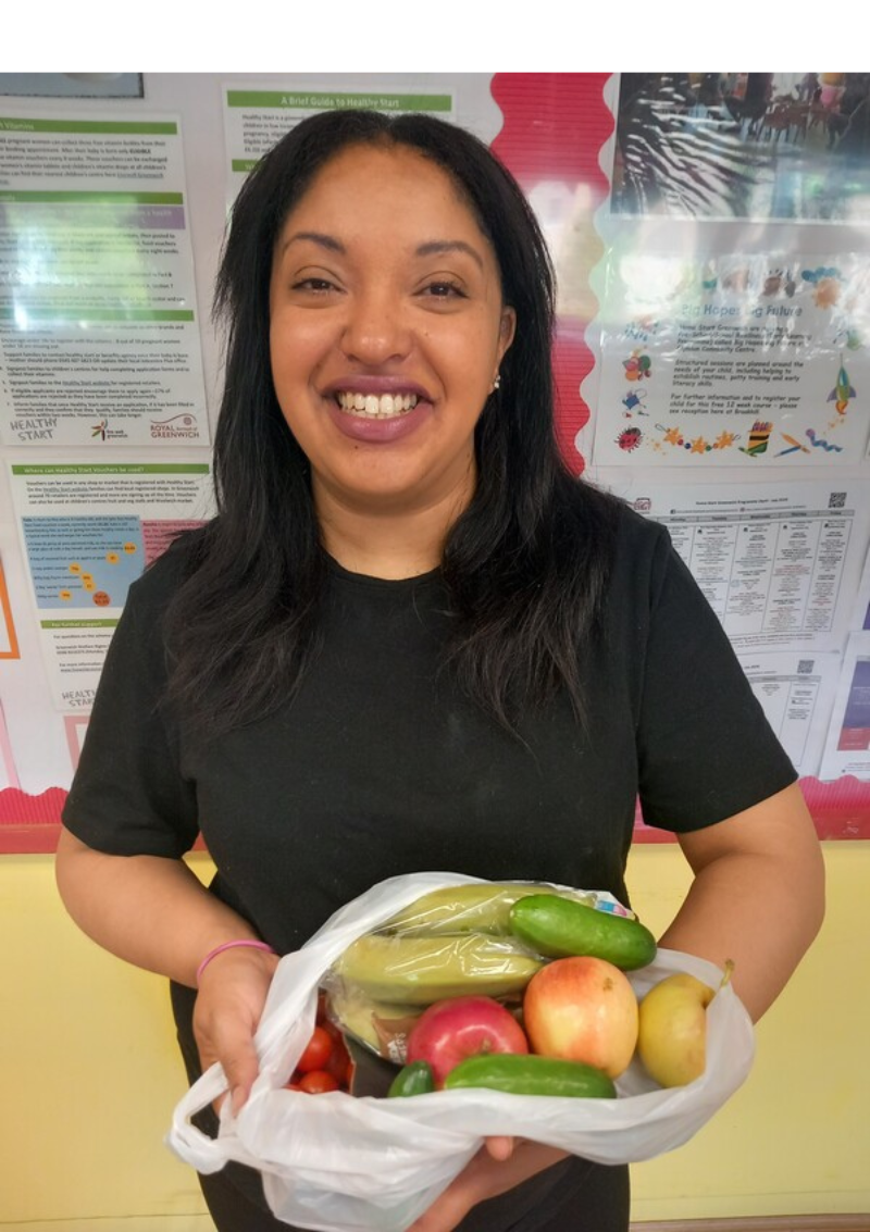 Woman holding bag of fresh fruit